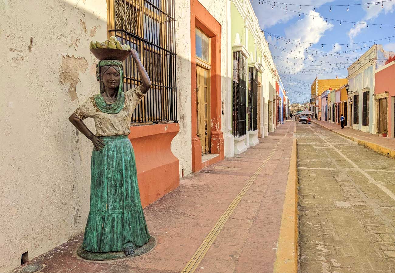 Day in Campeche a brass statue of a lady carrying fruit