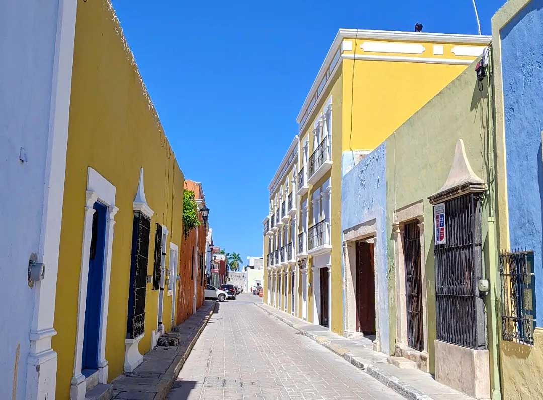 Lovely yellow buildings on a narrow street in Campeche