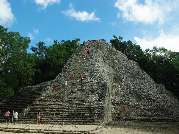 People climbing Coba Yucatan Ruins before the ban