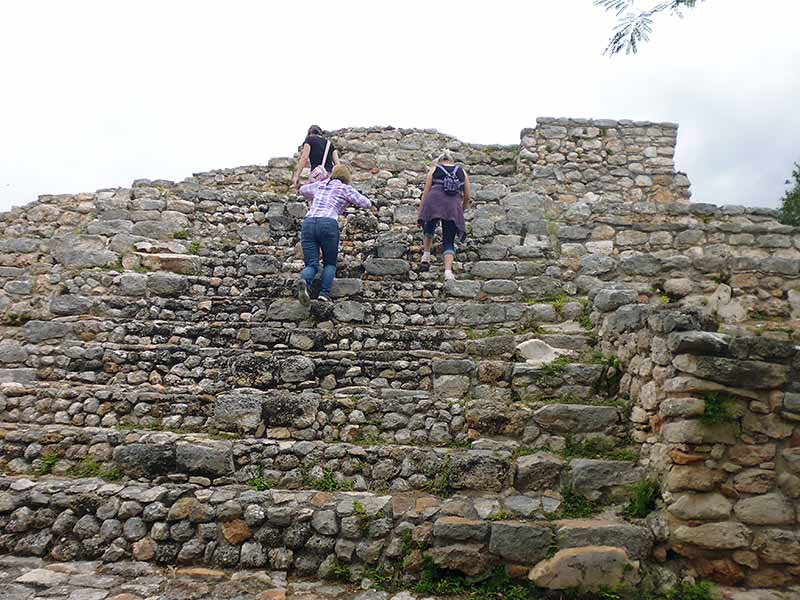 Climbing the pyramid at Acanceh Mayan Ruins