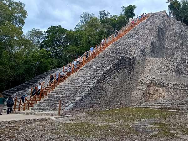 Climbing Nohoch Mul pyramid at Coba ruins 2026 with new wooden staircase